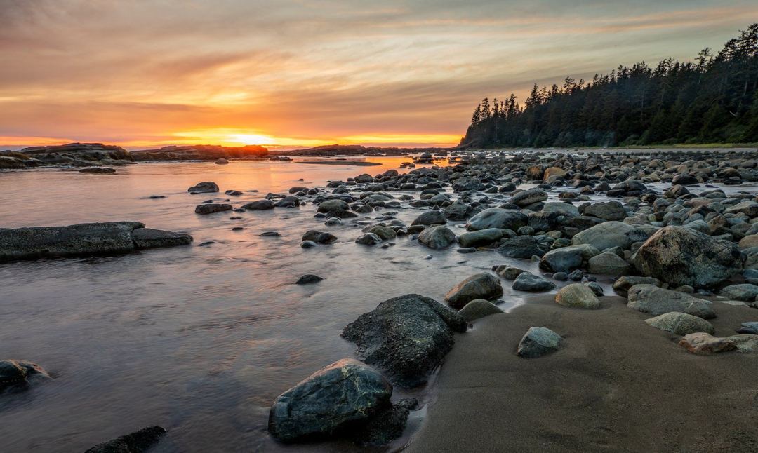 Rocky shoreline on British Columbia's west coast at sunset